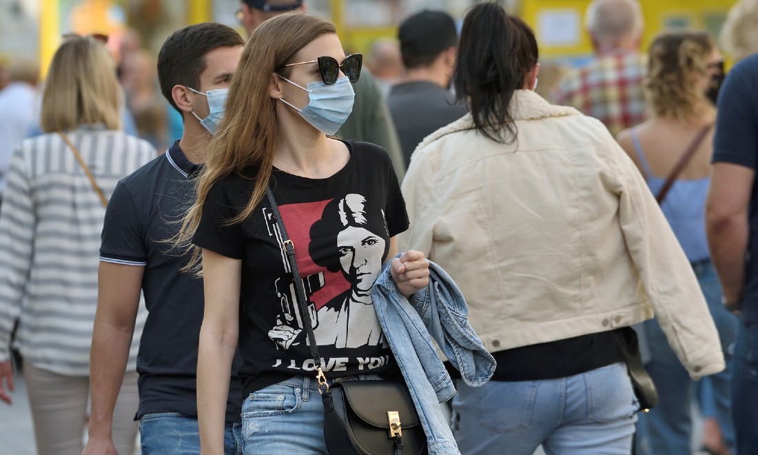 people walking on street face masks