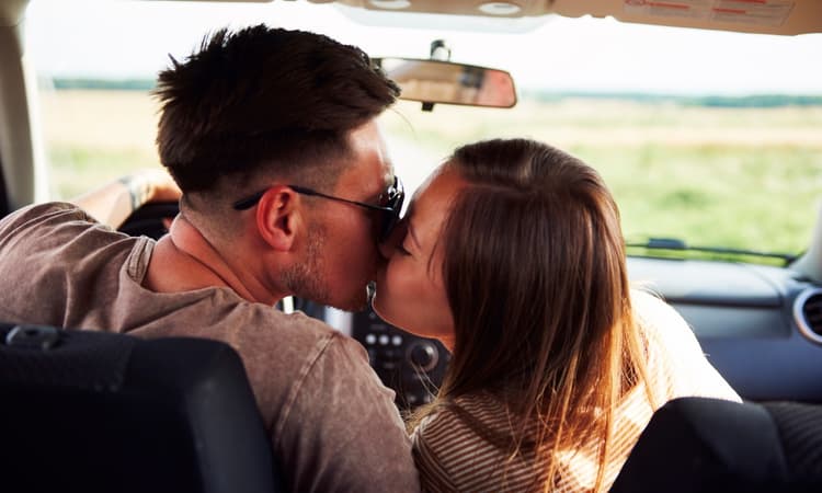 New Swiss driver crashes car into barrier while snogging