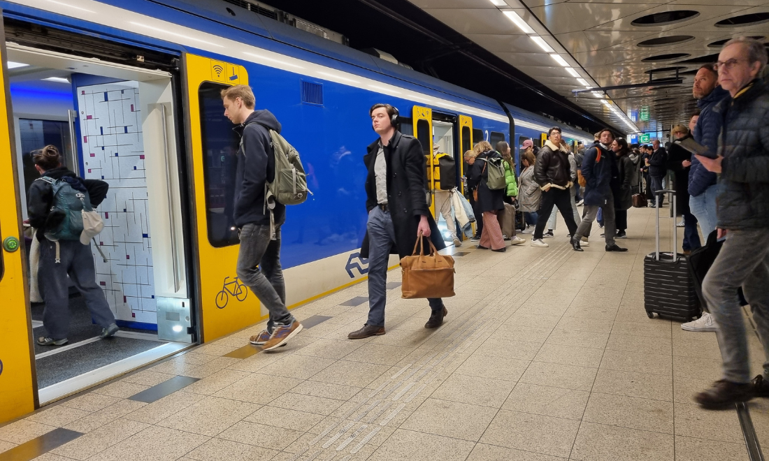 Train passengers at Schiphol Airport train station