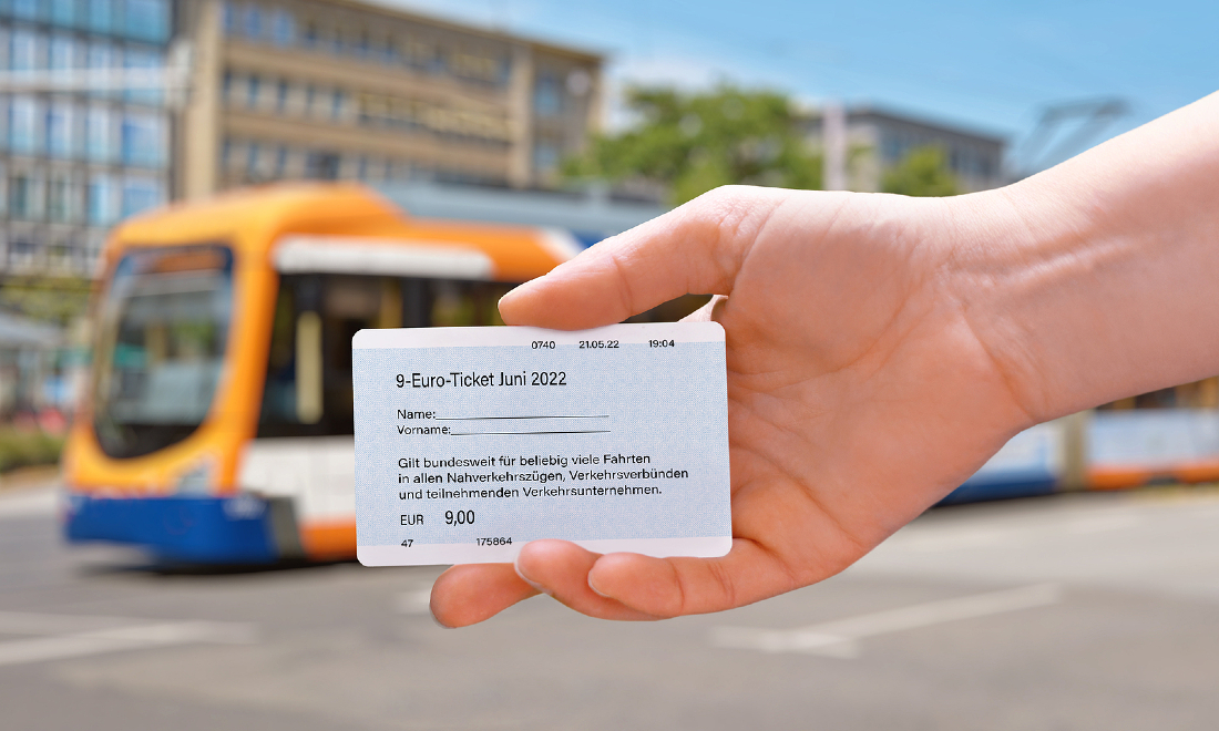 hand holding 9-euro ticket
