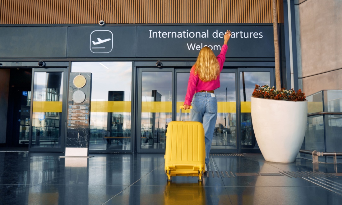 woman at airport - AGS: Top 5 countries residents of Germany are flocking to in 2024