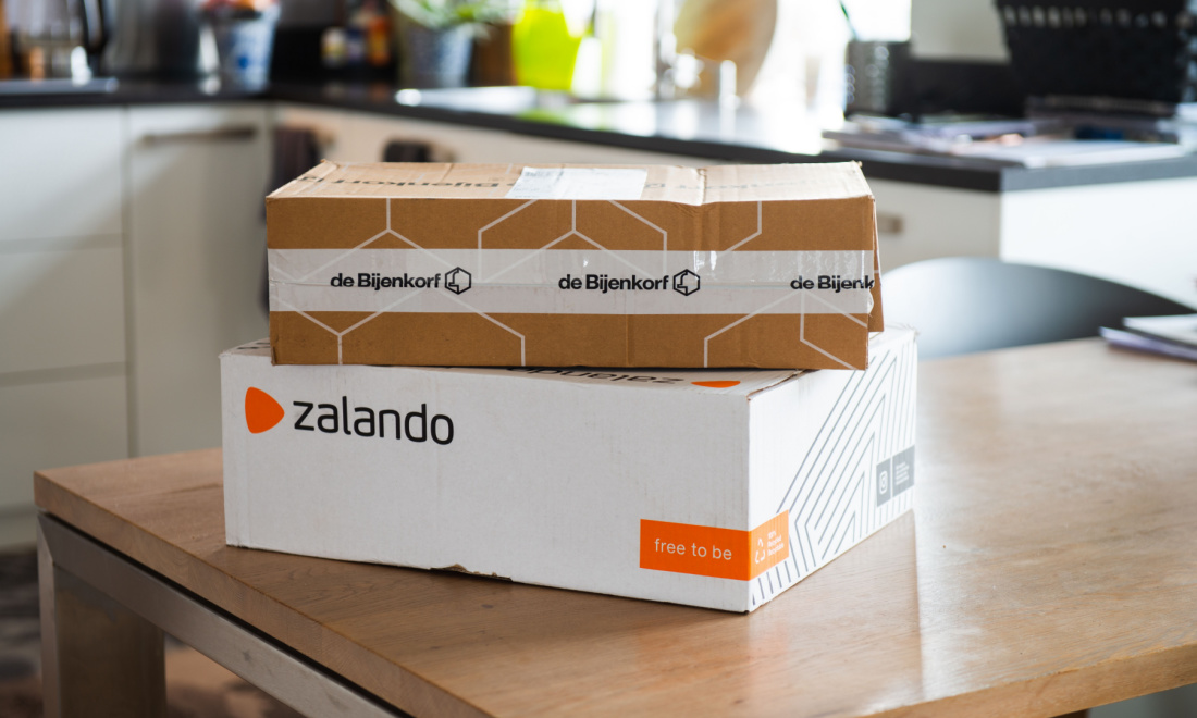 Online order packages on a kitchen countertop in Germany