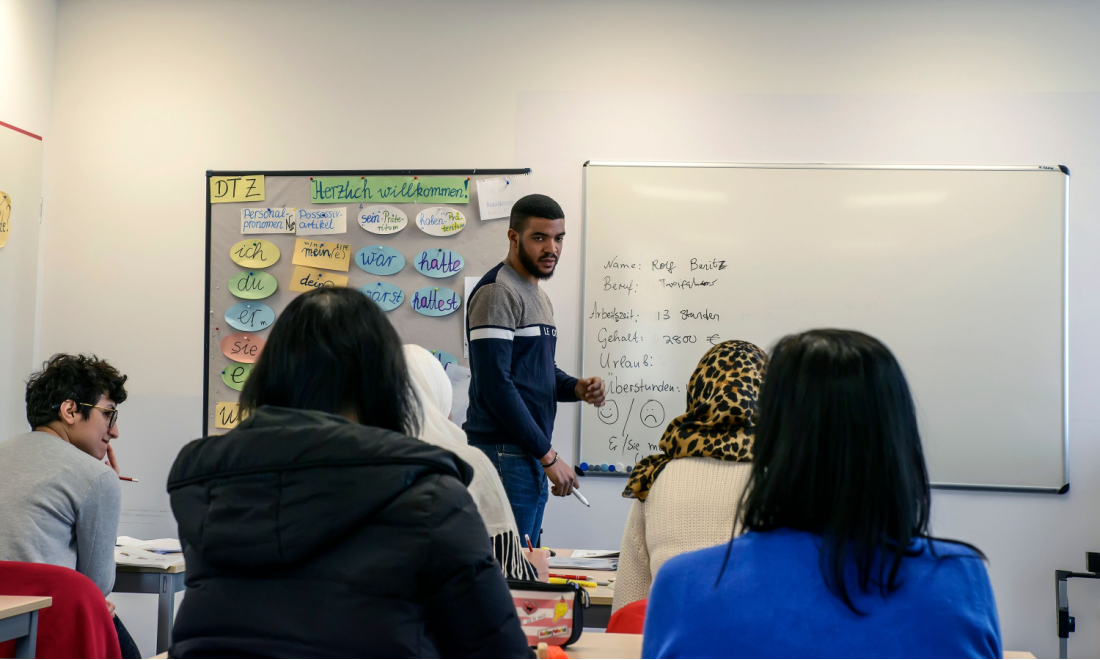 Migrants in a German language class