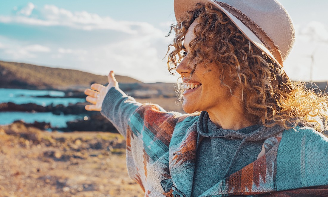 Happy woman standing in field