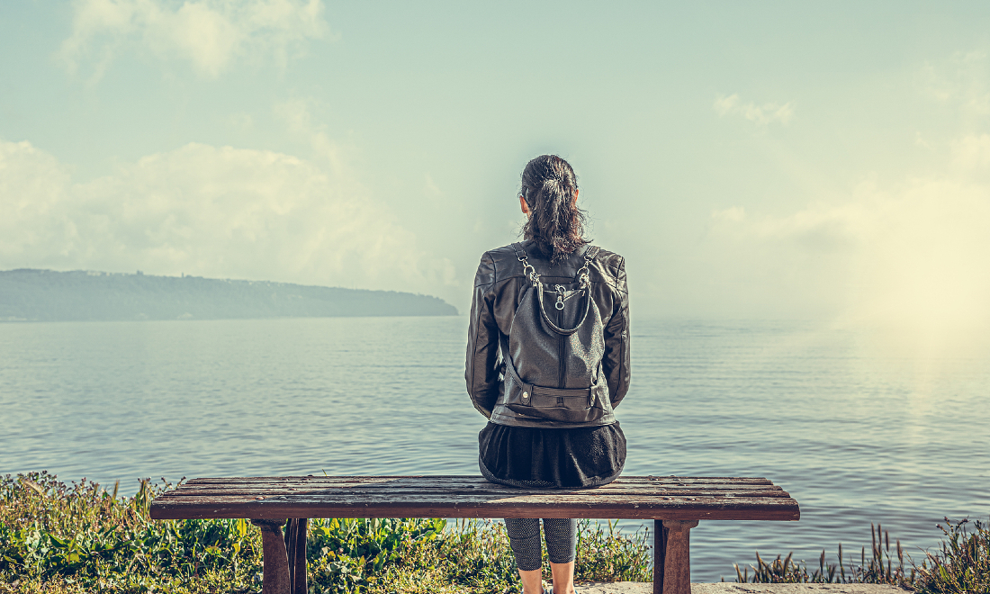 lonely woman sitting on a bench
