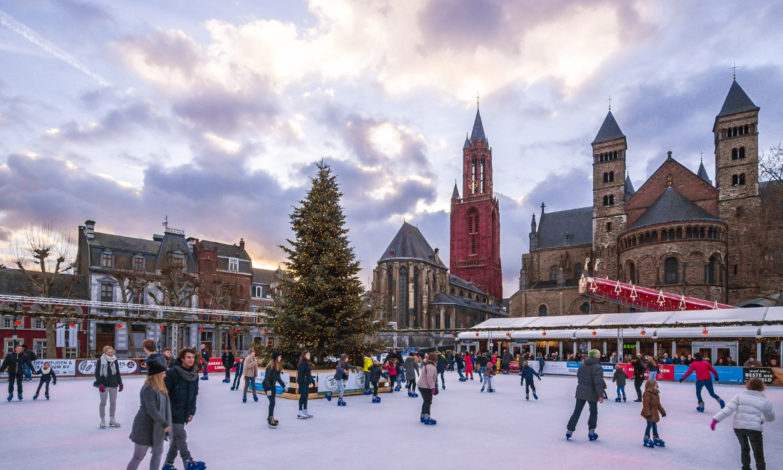 People skating at Christmas ice rink in Maastricht, the Netherlands