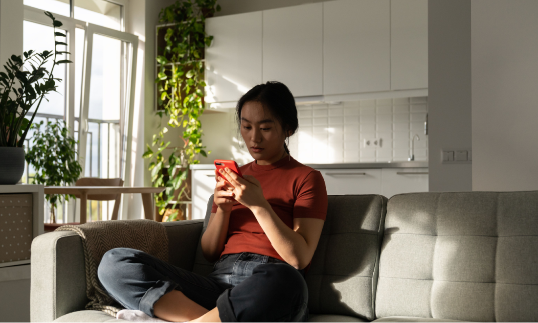 German woman using Google on her phone