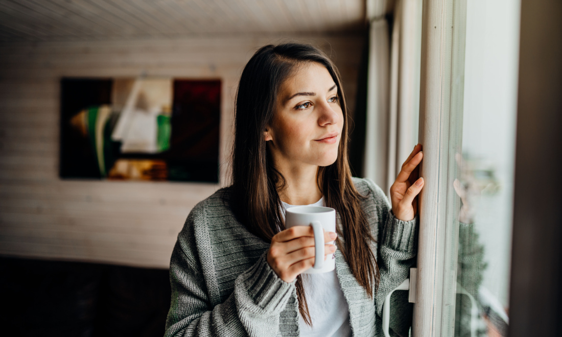 woman looking out window