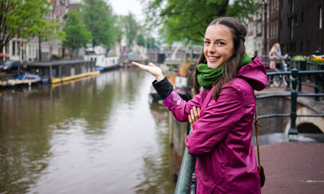 girl smiling purple raincoat