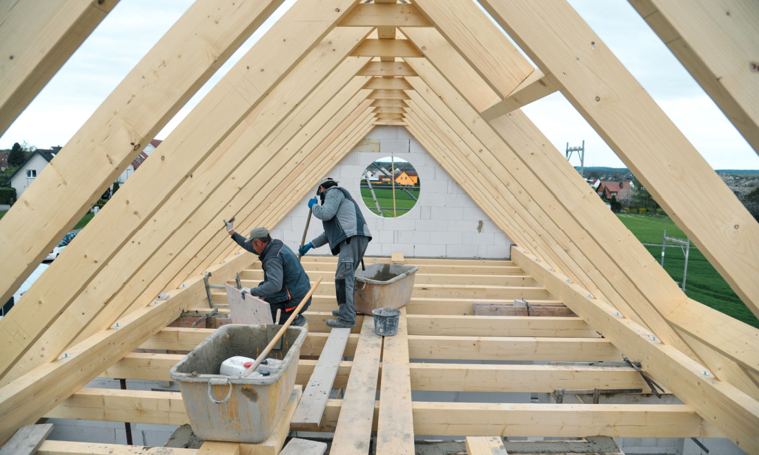 Carpentry workers building a roof in Germany