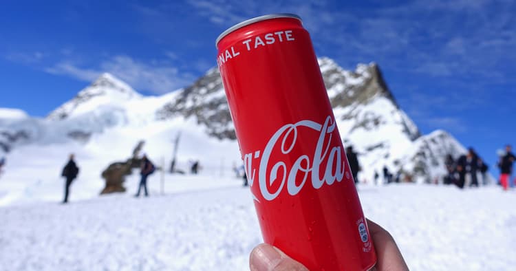 Why have supermarkets stopped buying Coca-Cola in Switzerland?
