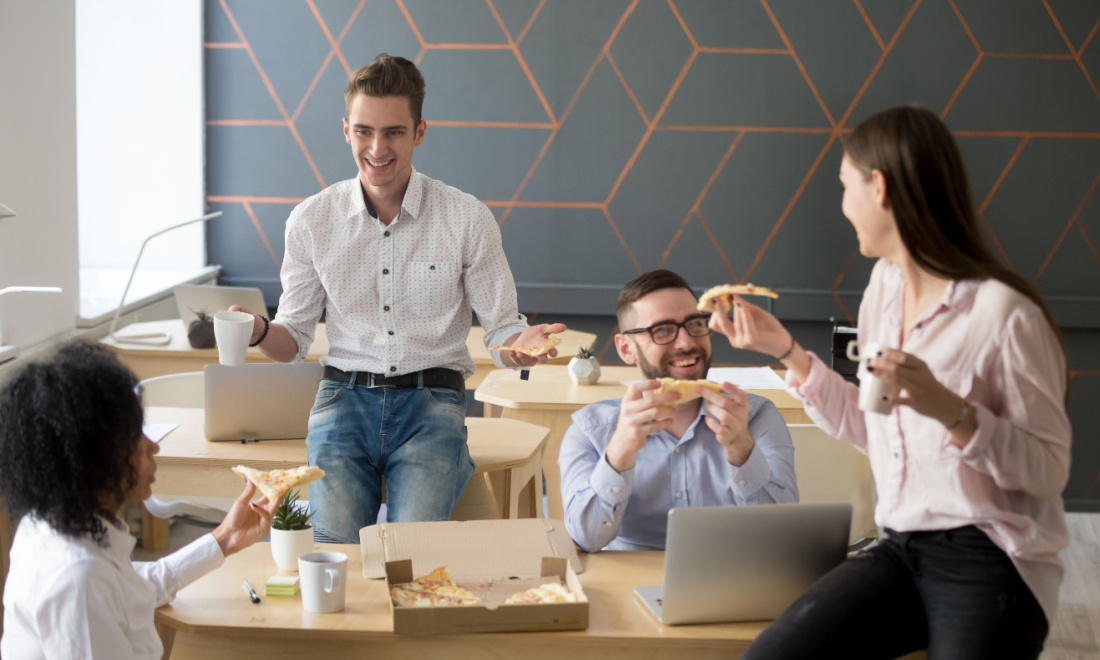 Coworkers having pizza party