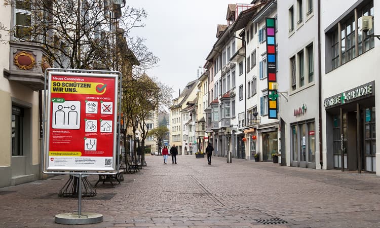 Swiss government under pressure to cut quarantine over Omicron