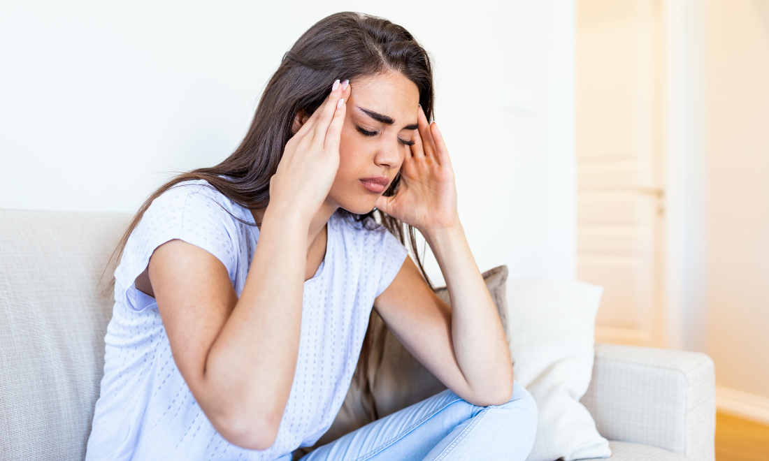 woman suffering with migraine