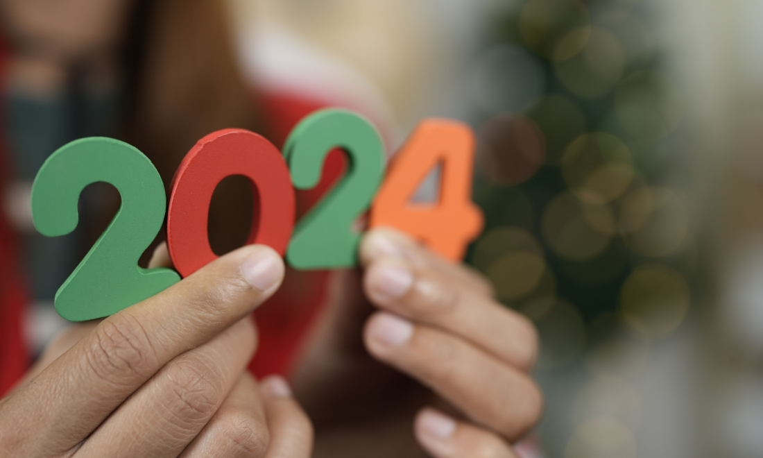 A German woman holding colourful 2024 figures