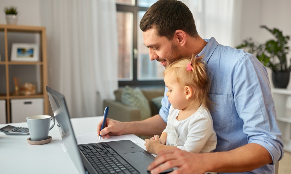 man working from home with daughter