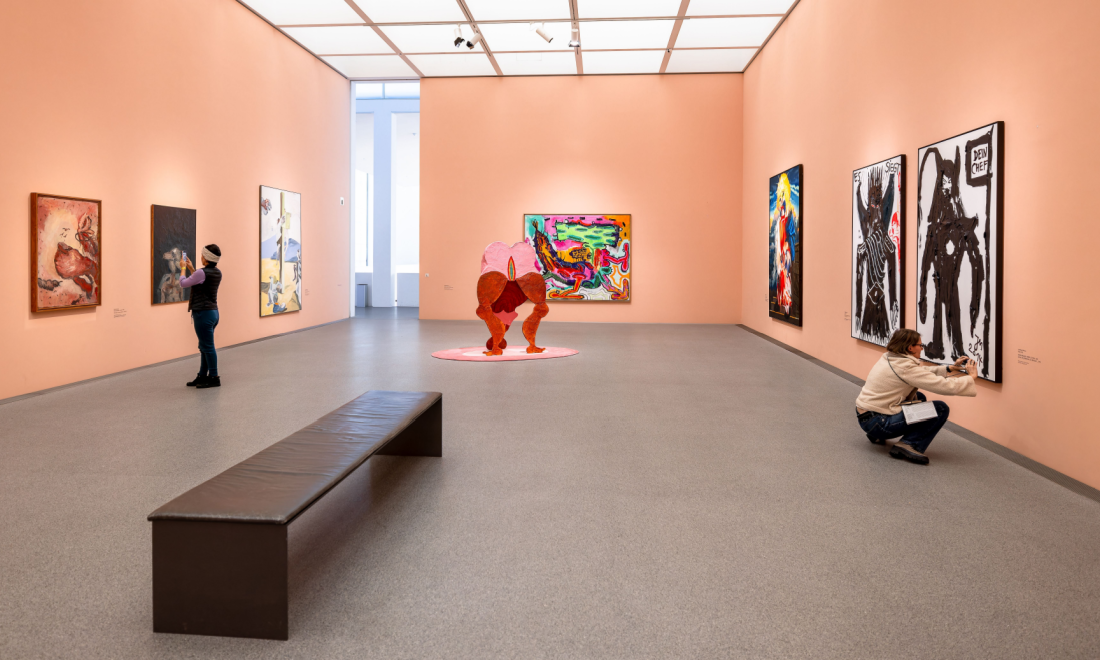 Employee hanging own work in Pinakothek modern museum Munich